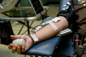 Plasma donor having blood drawn during a blood drive. 